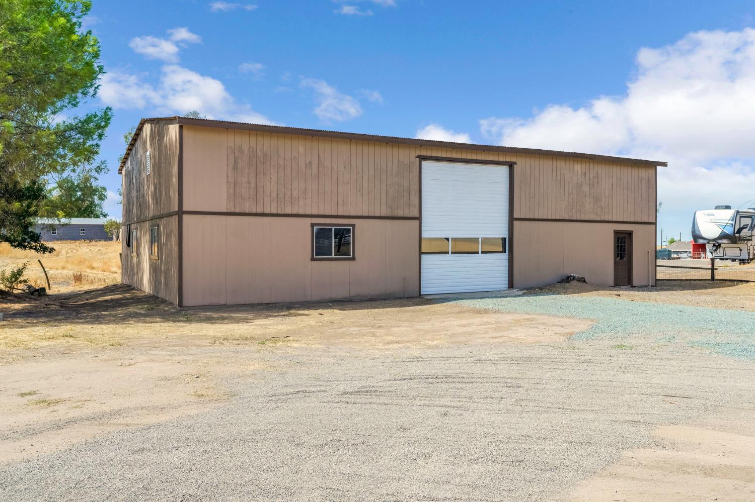 16860 Mark Road Madera, CA 93636 - Photo 33 of 44 a view of garage with a refrigerator