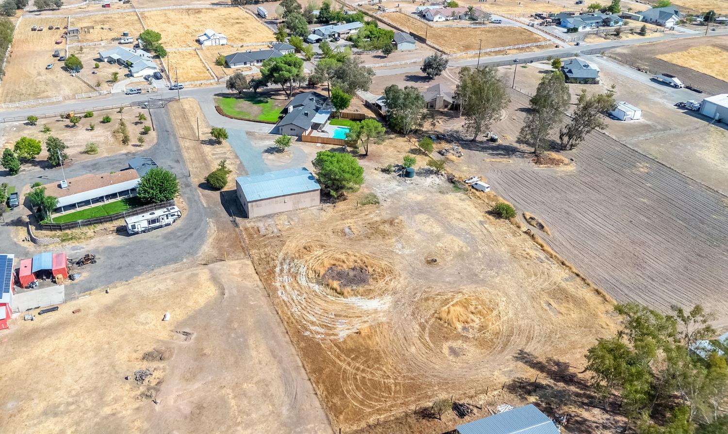 16860 Mark Road Madera, CA 93636 - Photo 37 of 44 an aerial view of a swimming pool with outdoor seating