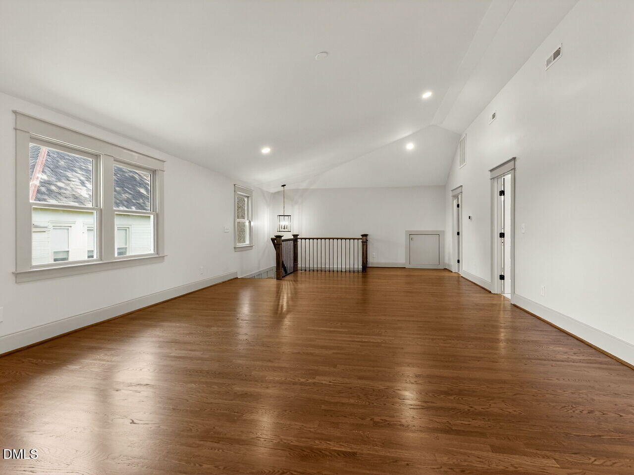 504 Tilden Street Raleigh, NC 27605 - Photo 49 of 58 a view of empty room with wooden floor and windows