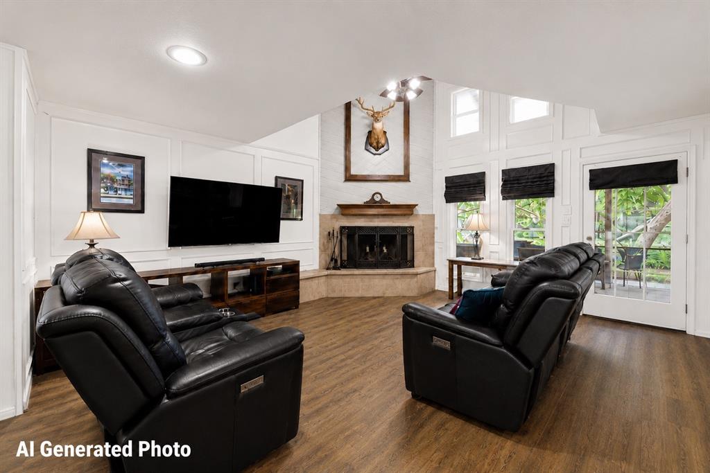 881 Wild Road Van Alstyne, TX 75495 - Photo 7 of 40 a living room with furniture flat screen tv and a fireplace