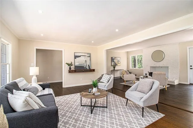 a living room with furniture and a table