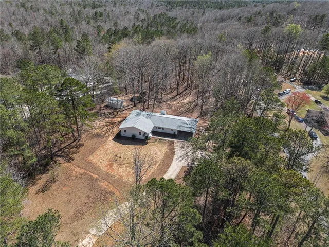 a view of a backyard with wooden fence