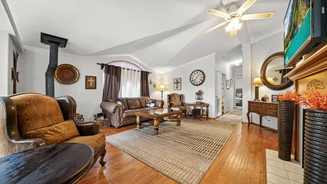 a living room with patio couch and a clock