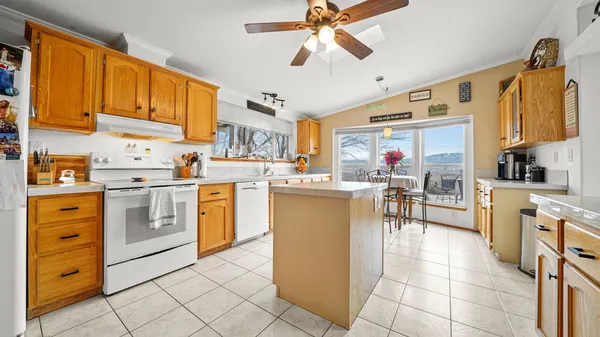 a kitchen with cabinets and window
