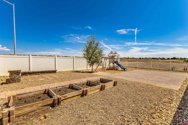 a swimming pool with outdoor seating and yard