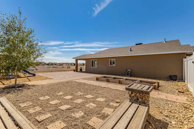 a house view with a backyard space