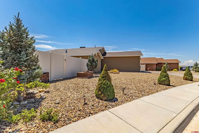 a view of a backyard of the house