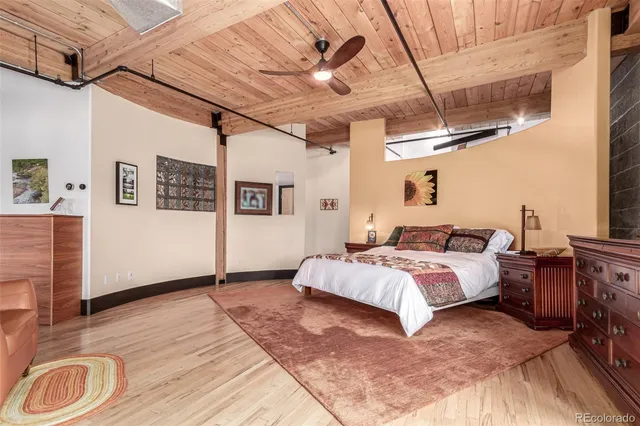 a bed room with a bed and a large window