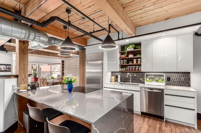 a kitchen with a sink a counter and cabinets