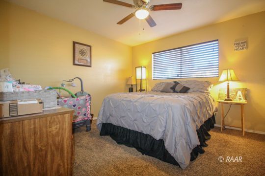 632 South Nevada Street Ridgecrest, CA 93555 - Photo 18 of 29 a bedroom with a bed and a window
