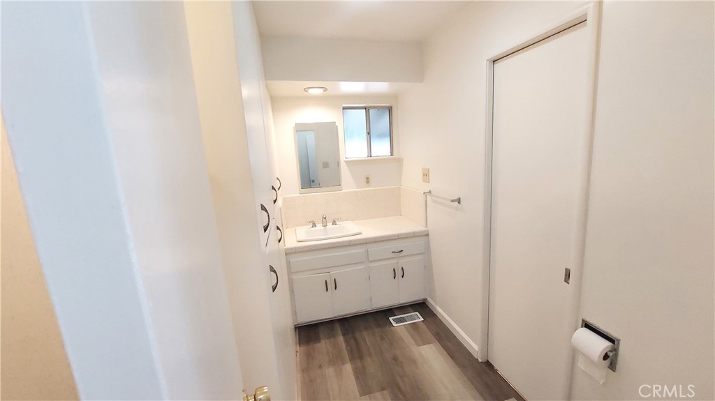 1909 Colusa Street Corning, CA 96021 - Photo 11 of 22 a bathroom with a sink mirror and a toilet