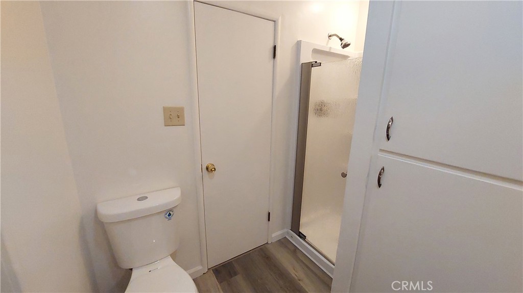 1909 Colusa Street Corning, CA 96021 - Photo 12 of 22 a bathroom with a granite countertop toilet and a shower