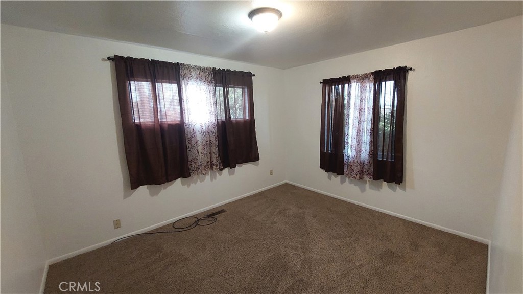 1909 Colusa Street Corning, CA 96021 - Photo 15 of 22 an empty room with windows