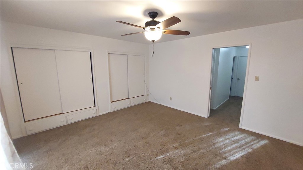 1909 Colusa Street Corning, CA 96021 - Photo 18 of 22 a view of an empty room with a ceiling fan