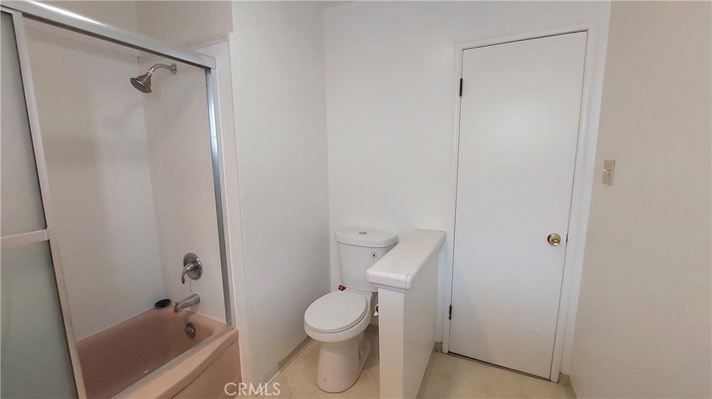 1909 Colusa Street Corning, CA 96021 - Photo 21 of 22 a bathroom with a toilet and a tub