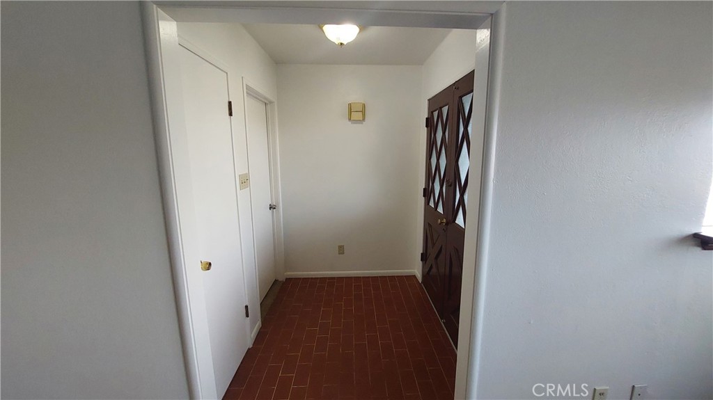 1909 Colusa Street Corning, CA 96021 - Photo 3 of 22 a view of a hallway with wooden floor