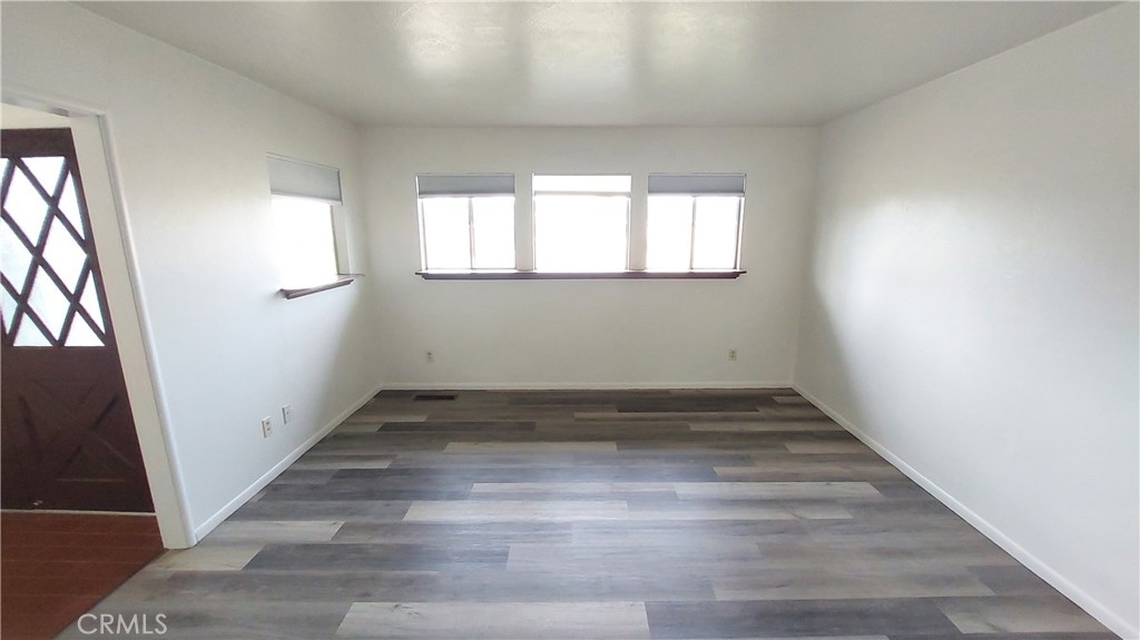1909 Colusa Street Corning, CA 96021 - Photo 5 of 22 a view of a room with wooden floors and white walls