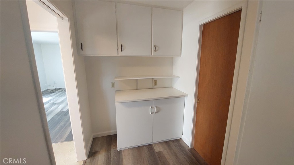 1909 Colusa Street Corning, CA 96021 - Photo 10 of 22 a view of walk in closet with wooden floor