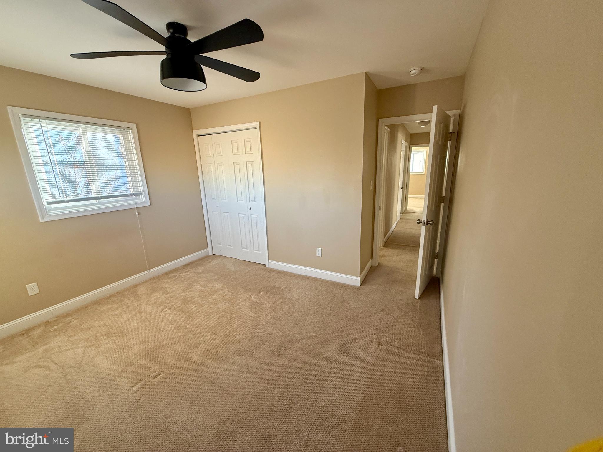 900 Southridge Road Catonsville, MD 21228 - Photo 19 of 31 a view of a livingroom with a ceiling fan and window