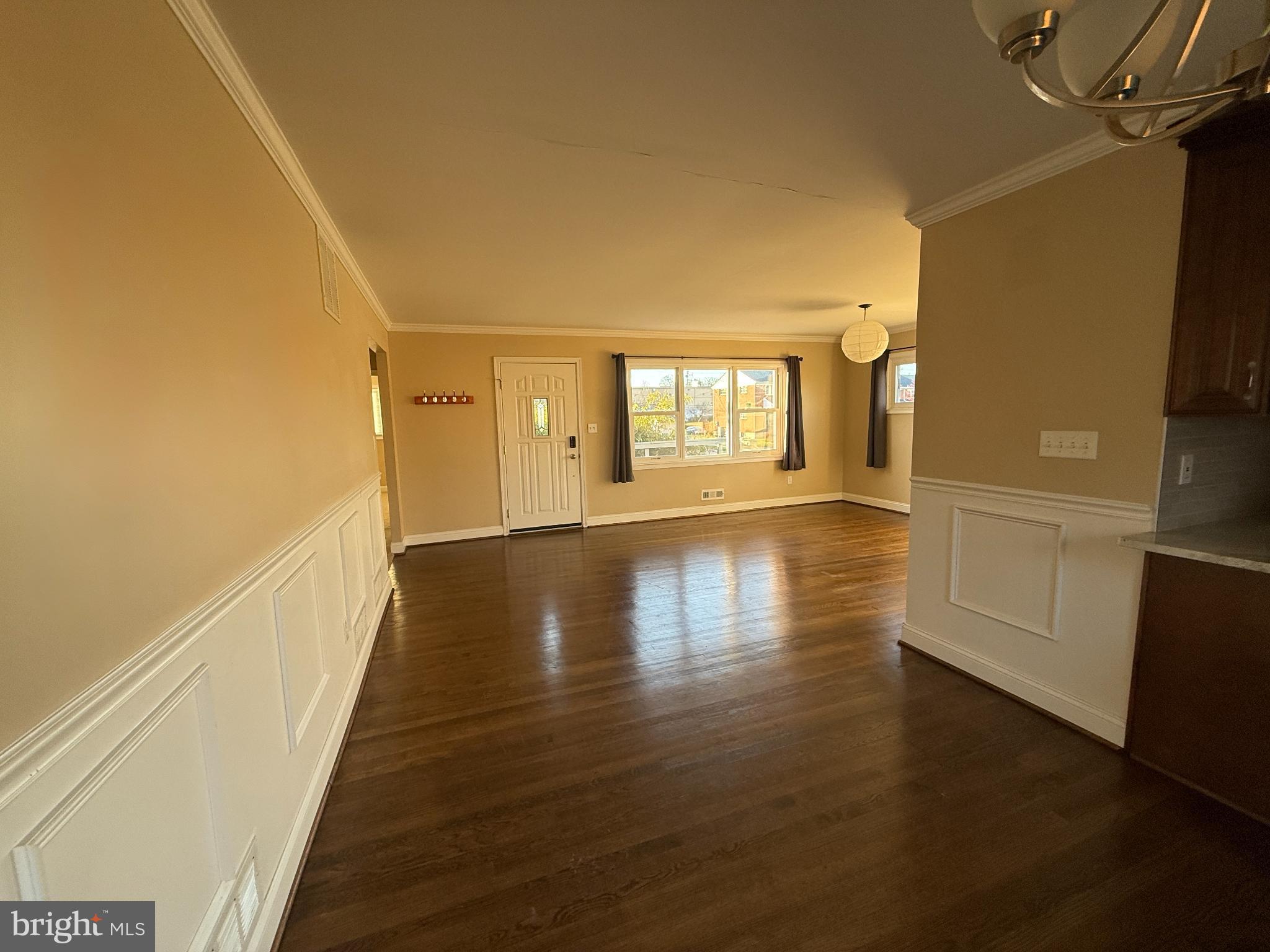 900 Southridge Road Catonsville, MD 21228 - Photo 5 of 31 a view of hallway with stairs and wooden floor