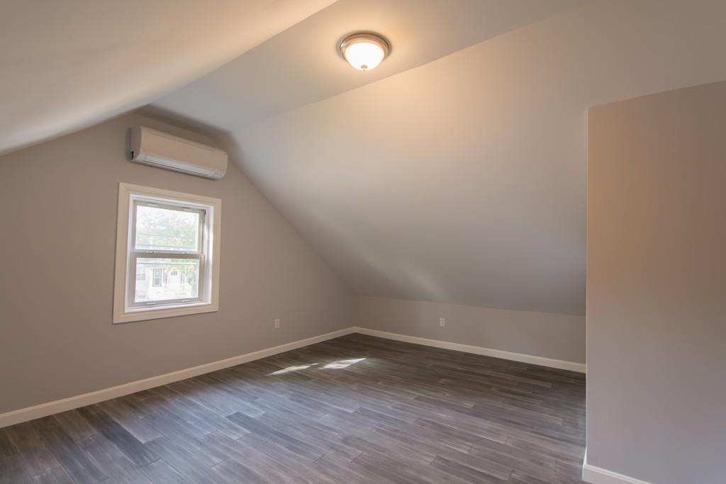 1570 County Street Somerset, MA 02726 - Photo 14 of 21 an empty room with wooden floor and windows
