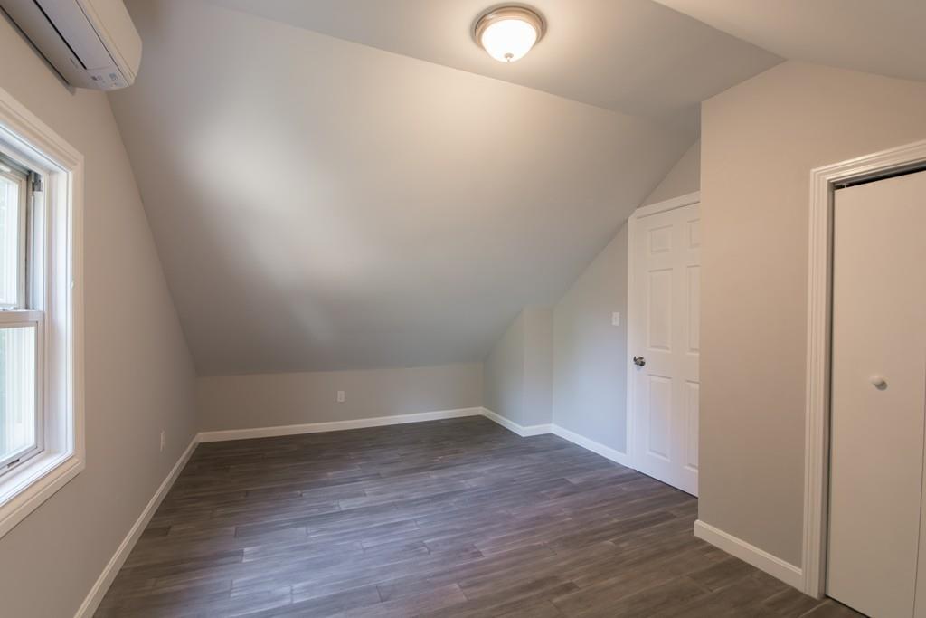 1570 County Street Somerset, MA 02726 - Photo 15 of 21 an empty room with wooden floor and windows