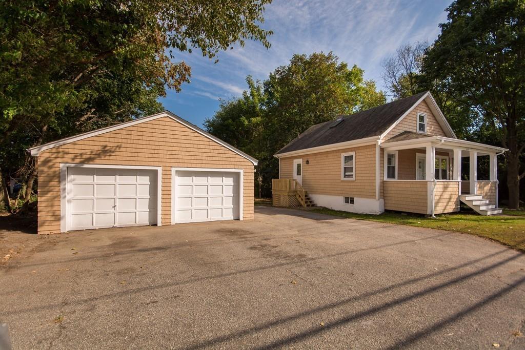 1570 County Street Somerset, MA 02726 - Photo 21 of 21 a front view of a house with a yard and garage