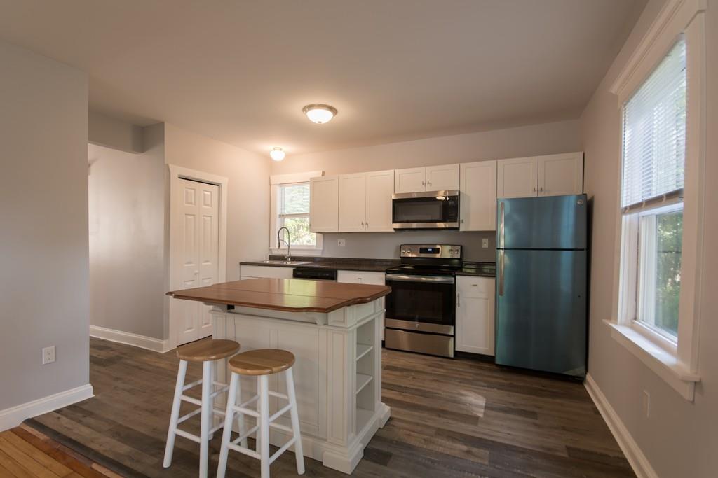 1570 County Street Somerset, MA 02726 - Photo 5 of 21 a kitchen with a refrigerator and a stove top oven