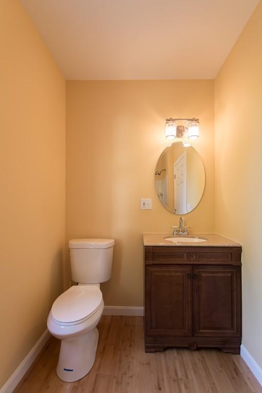 1570 County Street Somerset, MA 02726 - Photo 10 of 21 a bathroom with a toilet a sink and mirror