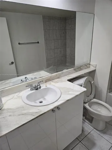 a bathroom with a sink and a toilet