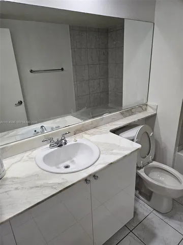 a bathroom with a sink and a toilet