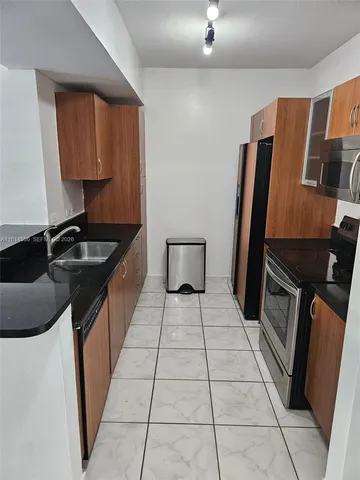 a close view of a stove top oven and cabinets