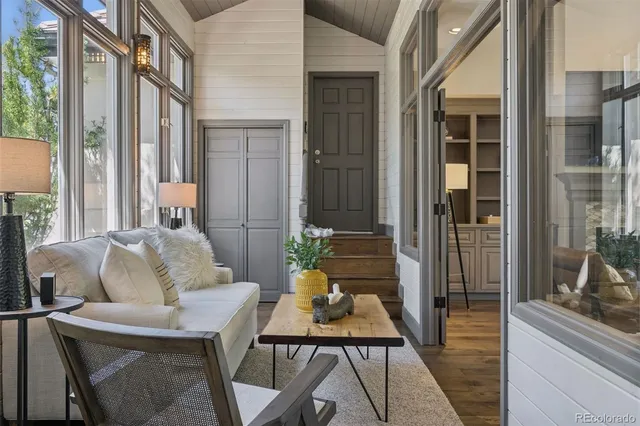 a balcony with furniture and a potted plant