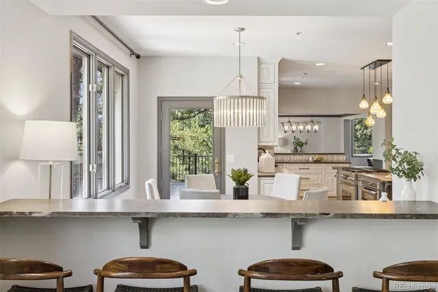 a kitchen with lots of counter space and appliances