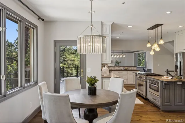 a view of a dining room with furniture window and wooden floor