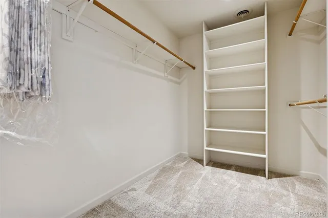 a view of an empty walk in closet