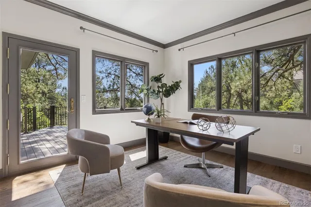 a view of a work space with furniture window and outside view