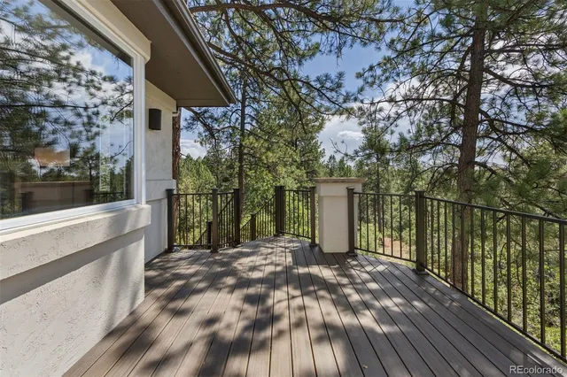 a view of backyard of house with wooden floor