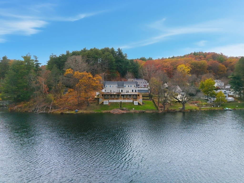 288 Grove Street, Unit 288 Clinton, MA 01510 - Photo 1 of 40 a view of a lake with mountain