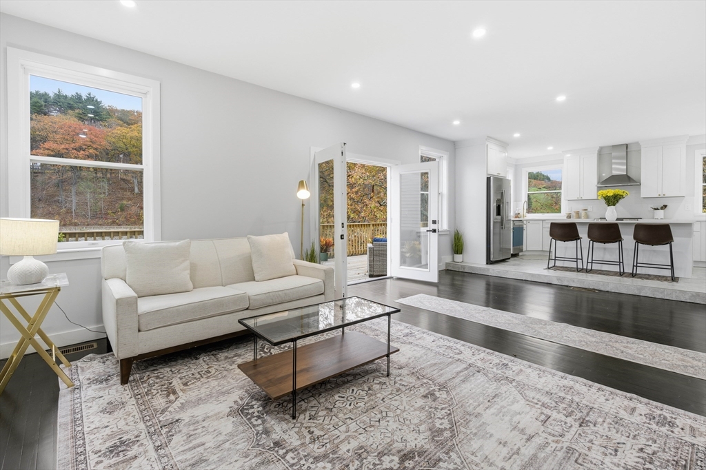 288 Grove Street, Unit 288 Clinton, MA 01510 - Photo 11 of 40 a living room with furniture and a large window