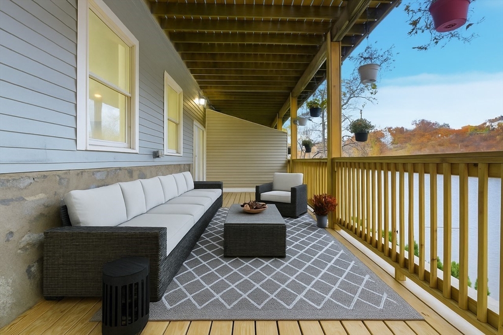 288 Grove Street, Unit 288 Clinton, MA 01510 - Photo 32 of 40 a balcony view with a couch