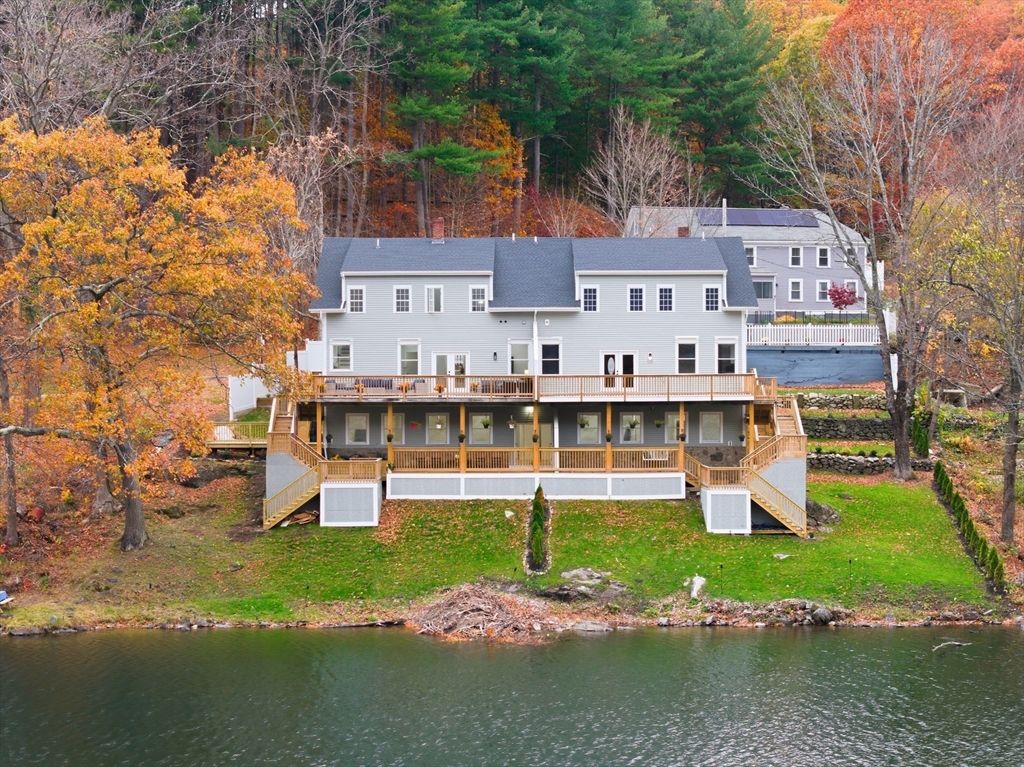 288 Grove Street, Unit 288 Clinton, MA 01510 - Photo 37 of 40 a front view of a house with a garden and plants