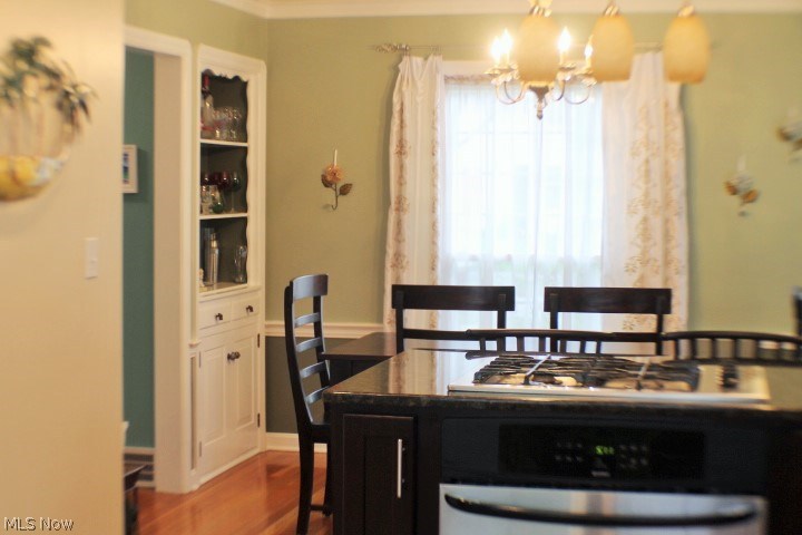 19238 Henry Road Fairview Park, OH 44126 - Photo 3 of 21 Custom gas range with granite counter top and cherry cabinetry overlooking dining room