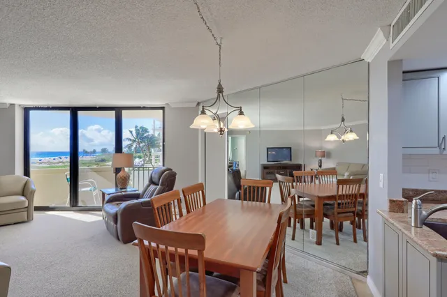 a view of a dining room with furniture window and outside view