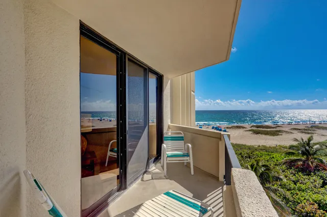 an aerial view of a house with a swimming pool yard and outdoor seating