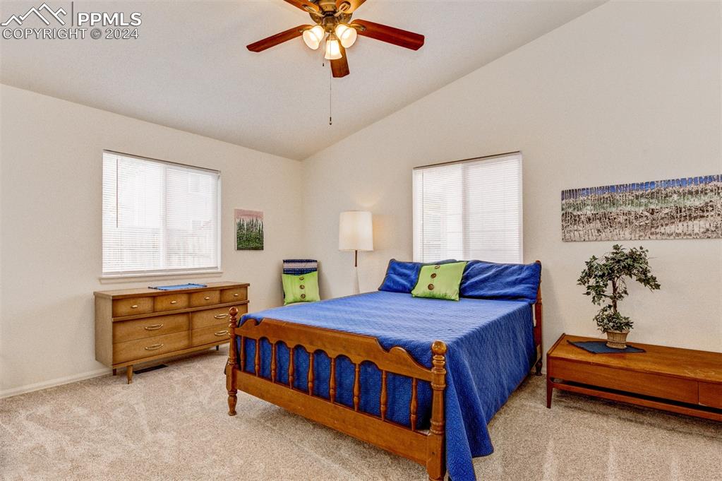 6385 Perfect View Colorado Springs, CO 80919 - Photo 18 of 35 Master bedroom with huge closet, luxury plush carpet, and attached remodeled 4 piece bathroom with water closet, double vanity and custom tile shower surround