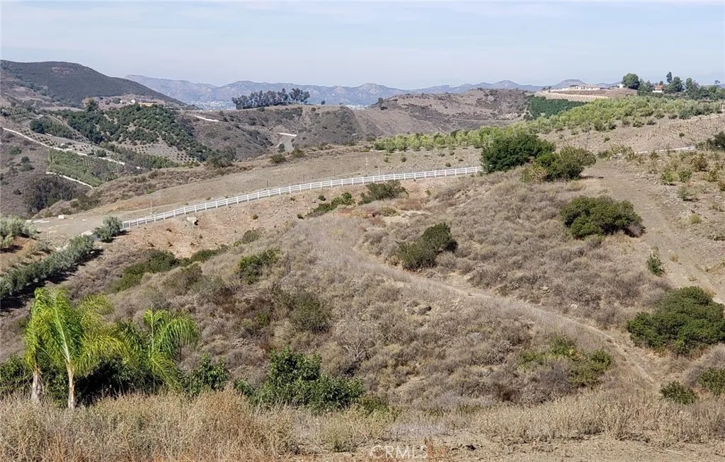 8 La Cruz Drive Temecula, CA 92590 - Photo 2 of 10 a view of a lake with mountains in the background