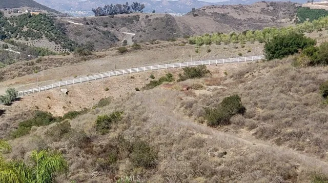 a view of a road with a yard