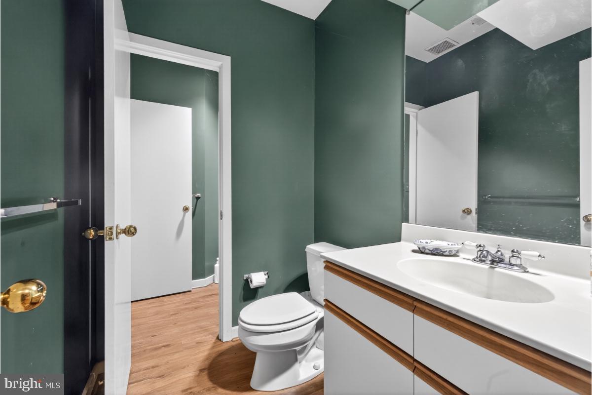 10320 Glen Road Potomac, MD 20854 - Photo 21 of 75 a bathroom with a sink a toilet and shower