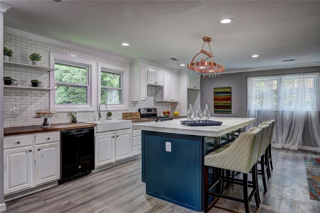 2333 Tarian Drive Decatur, GA 30034 - Photo 1 of 1 a kitchen with granite countertop a stove a sink dishwasher and a refrigerator